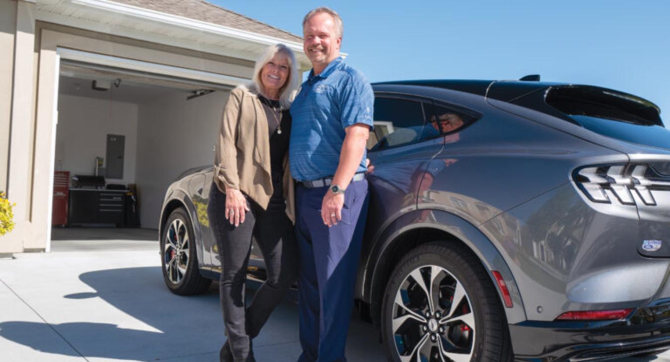 Tony and his wife Tracy with their all-electric 2021 Ford Mustang Mach-E.